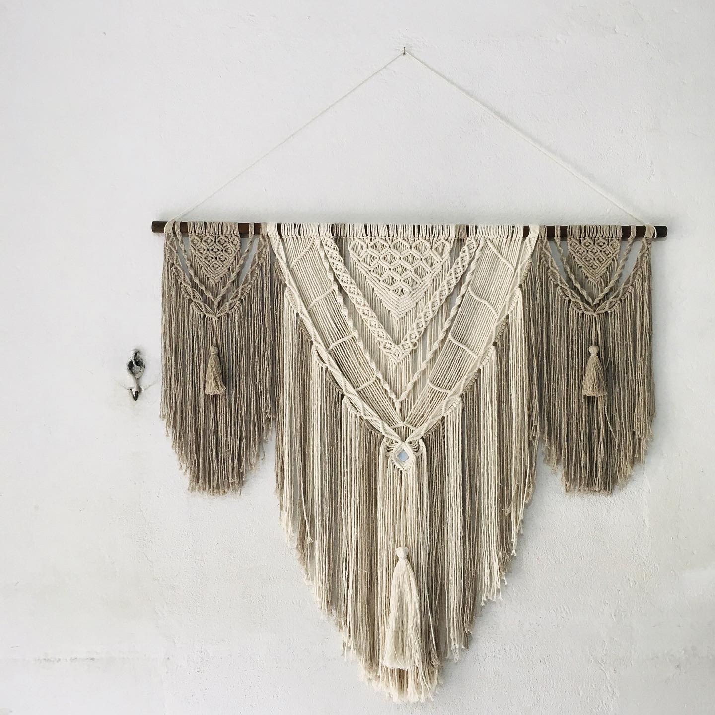 V-shaped wall piece with central diamond pattern